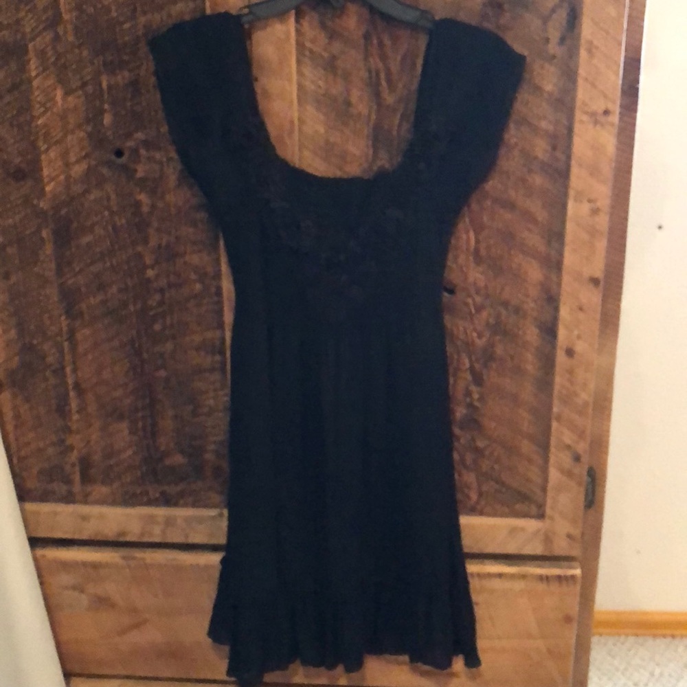 Women’s small black dress.